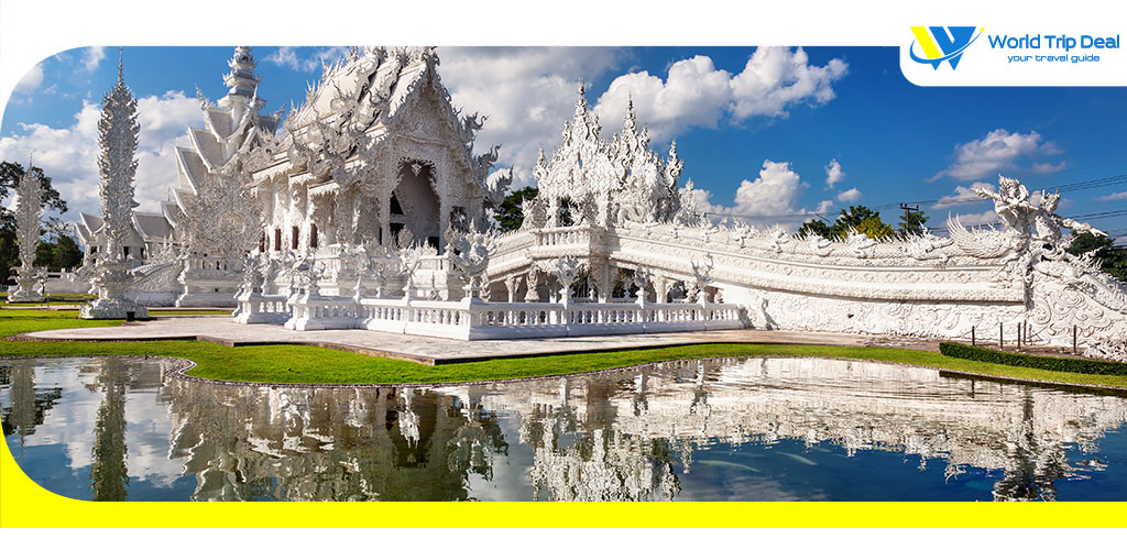 Wat rong khun the white temple and pond with fish in chiang rai thailand – world trip deal
